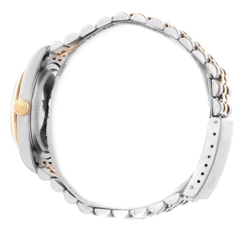 This image shows a side view of a Rolex Datejust 16233 Men's Steel and Gold (two tone) Champagne Dial 16233 Men's Steel and Gold (two tone) Champagne Dial watch, highlighting the crown and bracelet.