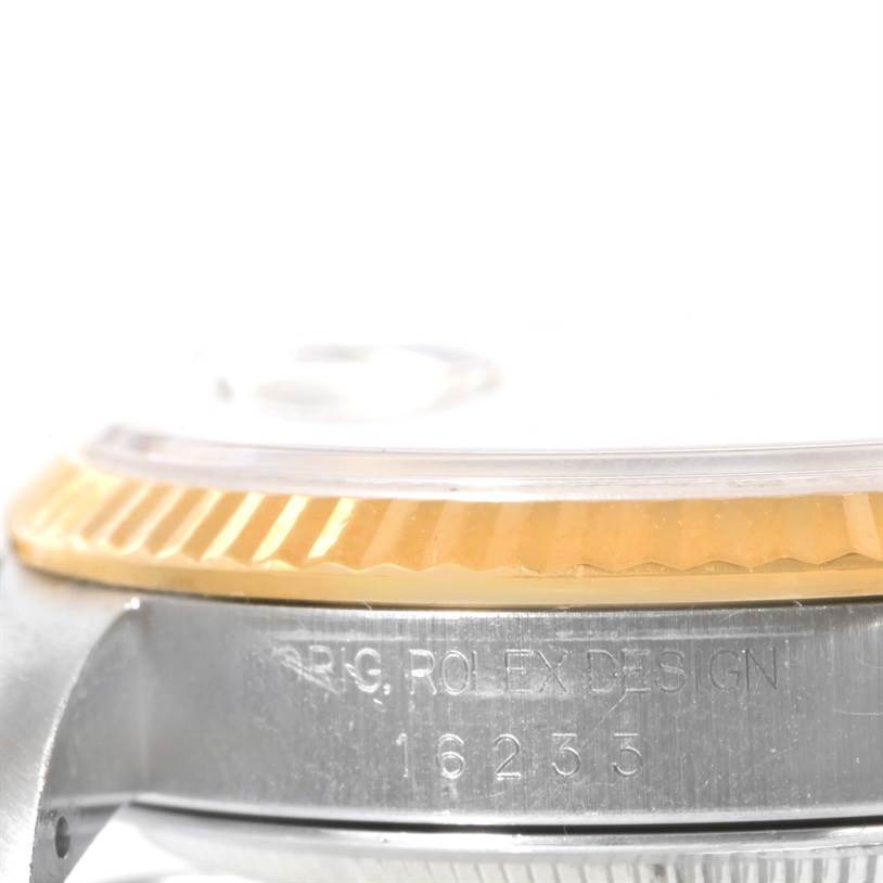 The image shows a close-up side view of the lower case and fluted bezel of a Rolex Datejust 16233 Men's Steel and Gold (two tone) Champagne Dial 16233 Men's Steel and Gold (two tone) Champagne Dial model, revealing the engraving "16233".