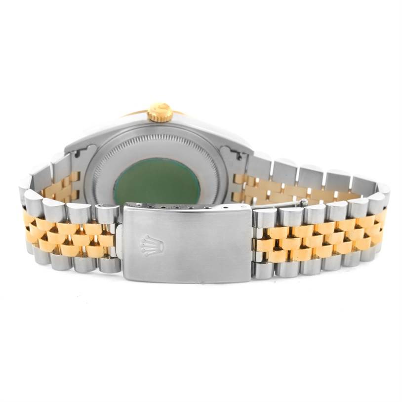 This image shows the backside and bracelet of a Rolex Datejust 16233 Men's Steel and Gold (two tone) Champagne Dial 16233 Men's Steel and Gold (two tone) Champagne Dial watch, focusing on the clasp and the two-tone metal design.