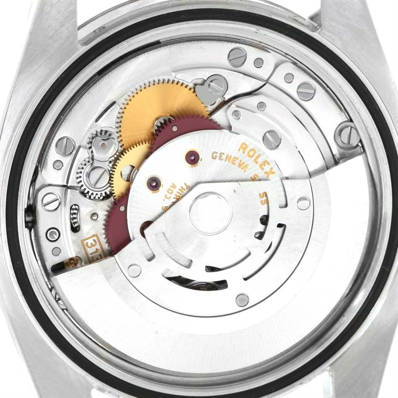 This image shows the internal mechanism and movement of a Rolex Datejust 116234BKDO Men's Stainless Steel Silver Dial 116234BKDO Men's Stainless Steel Silver Dial watch from a rear angle.