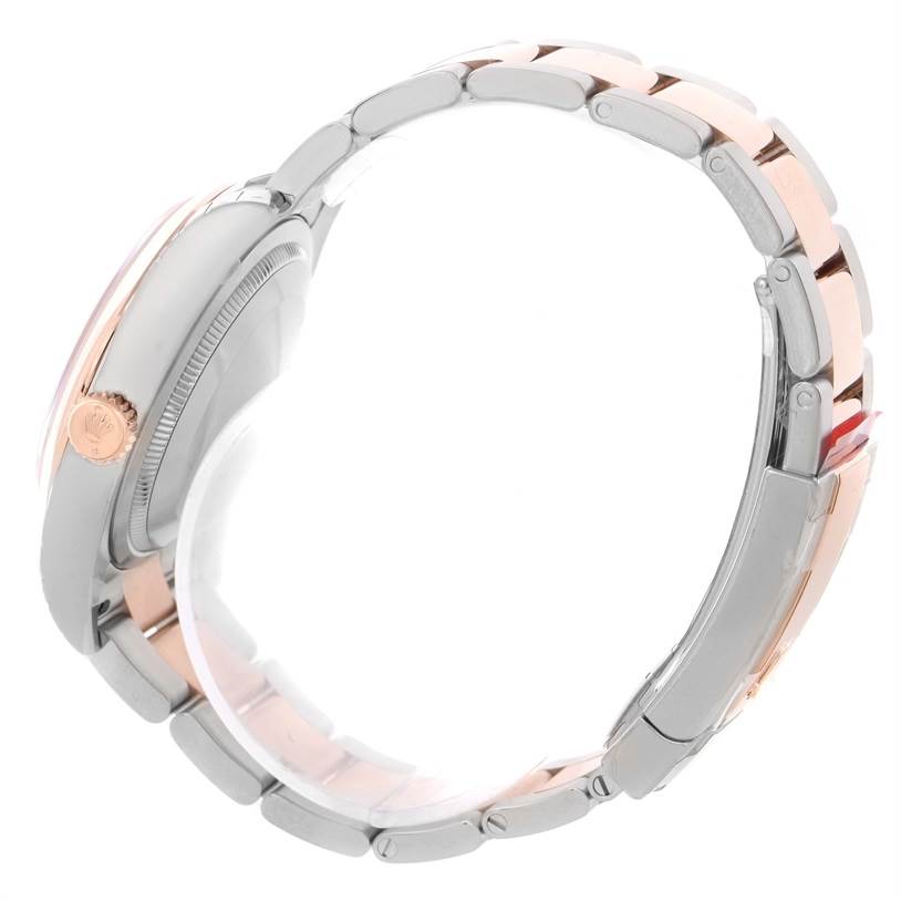 The image shows a side view of the Rolex Datejust 116201PKRO Men's Steel and Gold (two tone) Pink Dial 116201PKRO Men's Steel and Gold (two tone) Pink Dial watch highlighting its crown and two-tone bracelet.