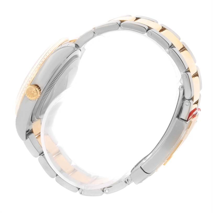 This side view of the Rolex Datejust 116233SSO Men
s Stainless Steel Silver Dial 116233SSO Men
s Stainless Steel Silver Dial watch highlights the case, crown, and two-tone bracelet.