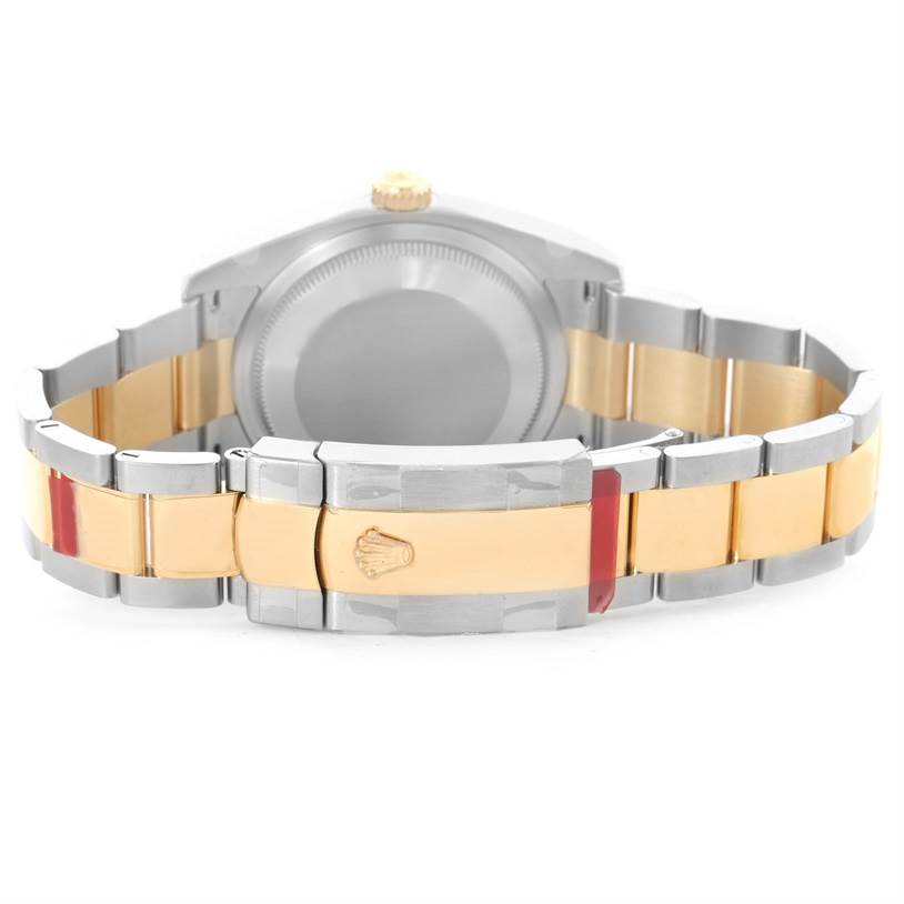 The image shows the back and bracelet of a Rolex Datejust 116233SSO Men
s Stainless Steel Silver Dial 116233SSO Men
s Stainless Steel Silver Dial watch, highlighting its two-tone design and clasp with the Rolex logo.