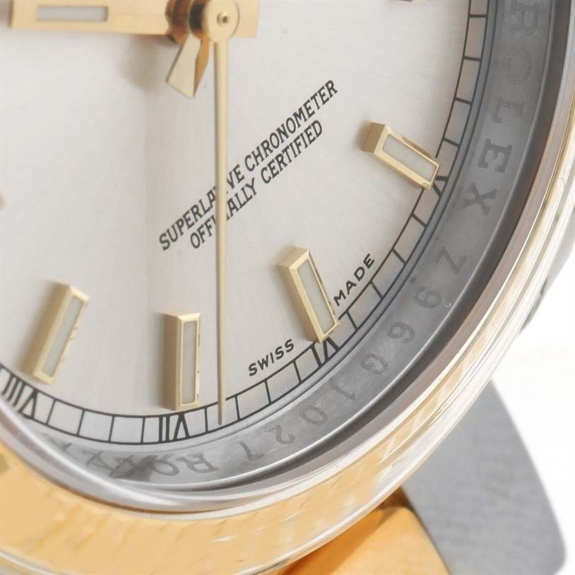 Close-up of the Rolex Datejust 116233SSO Men
s Stainless Steel Silver Dial 116233SSO Men
s Stainless Steel Silver Dial watch face showing the dial, markers, and part of the bezel.