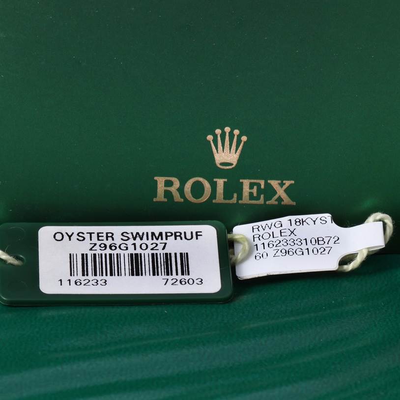 The image shows two tags for the Rolex Datejust 116233SSO Men
s Stainless Steel Silver Dial 116233SSO Men
s Stainless Steel Silver Dial model, including a green tag labeled "Oyster Swimpruf" and a white tag with model details.
