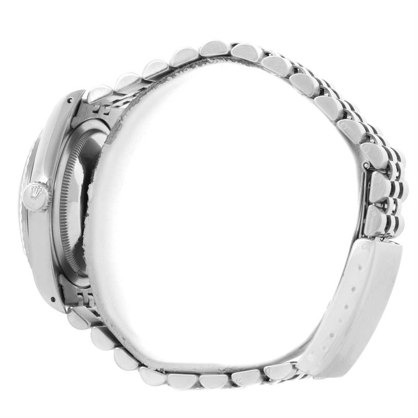 The image shows a side view of a Rolex Datejust 16220 Men's Stainless Steel Silver Dial 16220 Men's Stainless Steel Silver Dial watch, highlighting its case, crown, and bracelet.