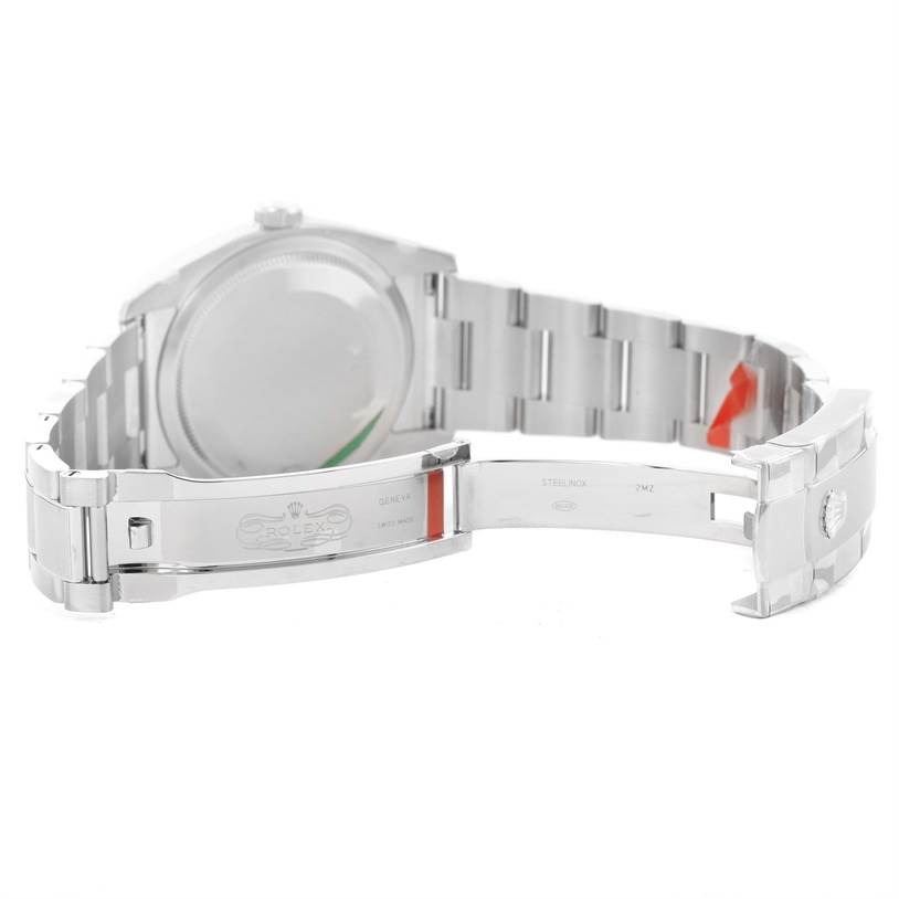 This image shows the backside of a Rolex Datejust 116200BKAO Men
s Stainless Steel Black Dial 116200BKAO Men
s Stainless Steel Black Dial watch, highlighting the open clasp and metal bracelet.