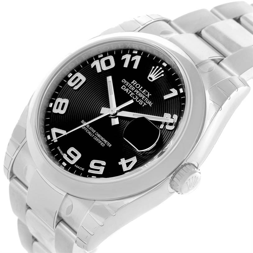 The image shows a Rolex Datejust 116200BKAO Men
s Stainless Steel Black Dial 116200BKAO Men
s Stainless Steel Black Dial watch from an angled view, highlighting the dial, bracelet, and crown.