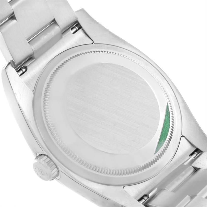 This image shows the back case and part of the bracelet clasp of a Rolex Datejust 116200WSO Men's Stainless Steel White Dial 116200WSO Men's Stainless Steel White Dial watch.
