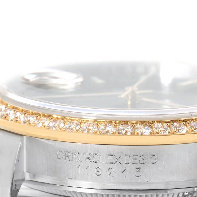 The image shows a close-up of the bezel, along with part of the dial and case of a Rolex Datejust 116243 Men
s Stainless Steel Black Dial 116243 Men
s Stainless Steel Black Dial watch.