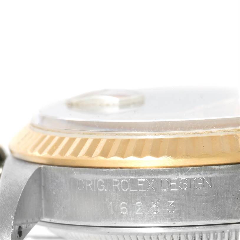 The image shows a close-up side view of the Rolex Datejust 16233 Men's Steel and Gold (two tone) Champagne Dial 16233 Men's Steel and Gold (two tone) Champagne Dial model's case, bezel, and part of the crystal.