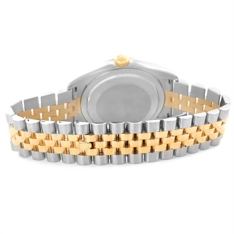 The image shows the back of a Rolex Datejust 116233 Men
s Stainless Steel White Dial 116233 Men
s Stainless Steel White Dial watch, focusing on the two-tone metal bracelet and case back.
