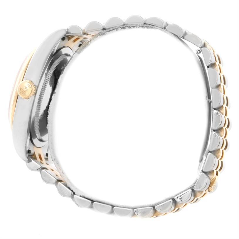 The image shows a side view of a Rolex Datejust 116233 Men
s Stainless Steel White Dial 116233 Men
s Stainless Steel White Dial watch, highlighting the crown and part of the bracelet.