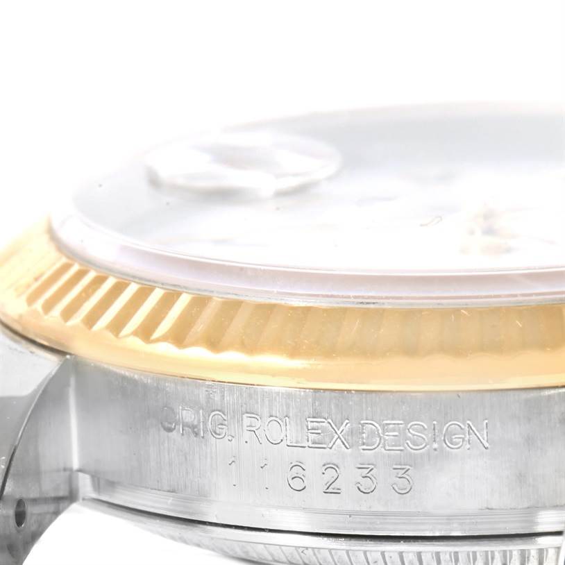 The image shows a close-up side view of the bezel, crystal, and part of the case of the Rolex Datejust 116233 Men
s Stainless Steel White Dial 116233 Men
s Stainless Steel White Dial watch.
