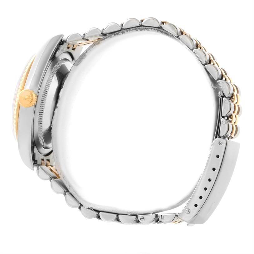 The image shows the side profile of a Rolex Datejust 16233 Men's Steel and Gold (two tone) Black Dial 16233 Men's Steel and Gold (two tone) Black Dial watch, highlighting its crown, bezel, and bracelet.