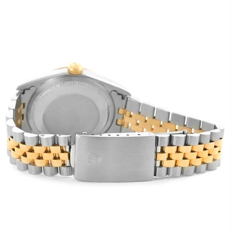 The image shows the back view of a Rolex Datejust 16233 Men's Steel and Gold (two tone) Black Dial 16233 Men's Steel and Gold (two tone) Black Dial watch, highlighting its stainless steel and gold Jubilee bracelet and clasp.