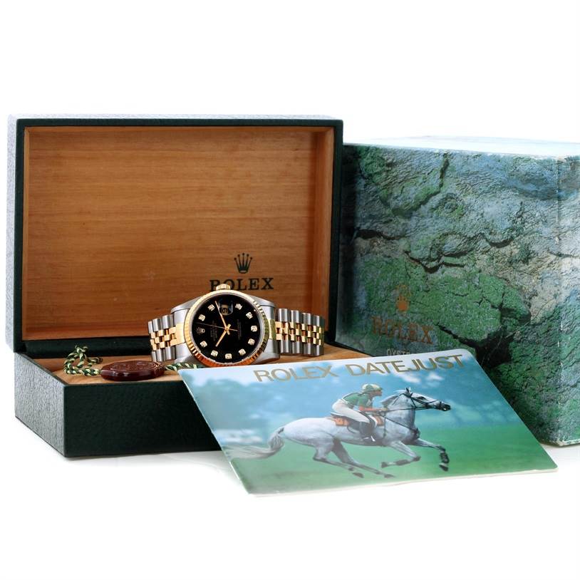 The image shows a Rolex Datejust 16233 Men's Steel and Gold (two tone) Black Dial 16233 Men's Steel and Gold (two tone) Black Dial watch in its open box with booklets and accessories, viewed from the front.
