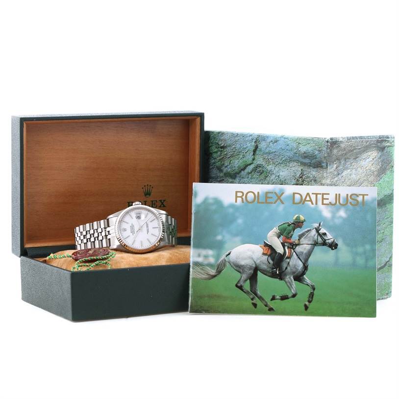 The image shows a Rolex Datejust 16234 Men's Stainless Steel White Dial 16234 Men's Stainless Steel White Dial watch in its box, along with a Rolex Datejust 16234 Men's Stainless Steel White Dial 16234 Men's Stainless Steel White Dial booklet and other accessories.
