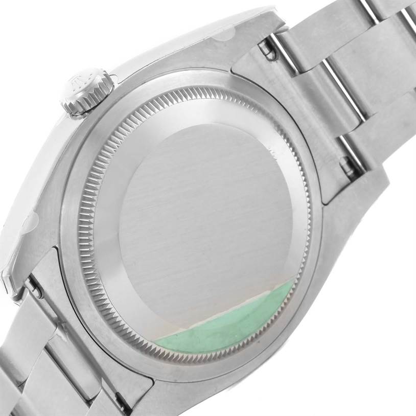 The image shows the back case and part of the bracelet of a Rolex Datejust 116200BKSO Men's Stainless Steel Black Dial 116200BKSO Men's Stainless Steel Black Dial watch from a side angle.