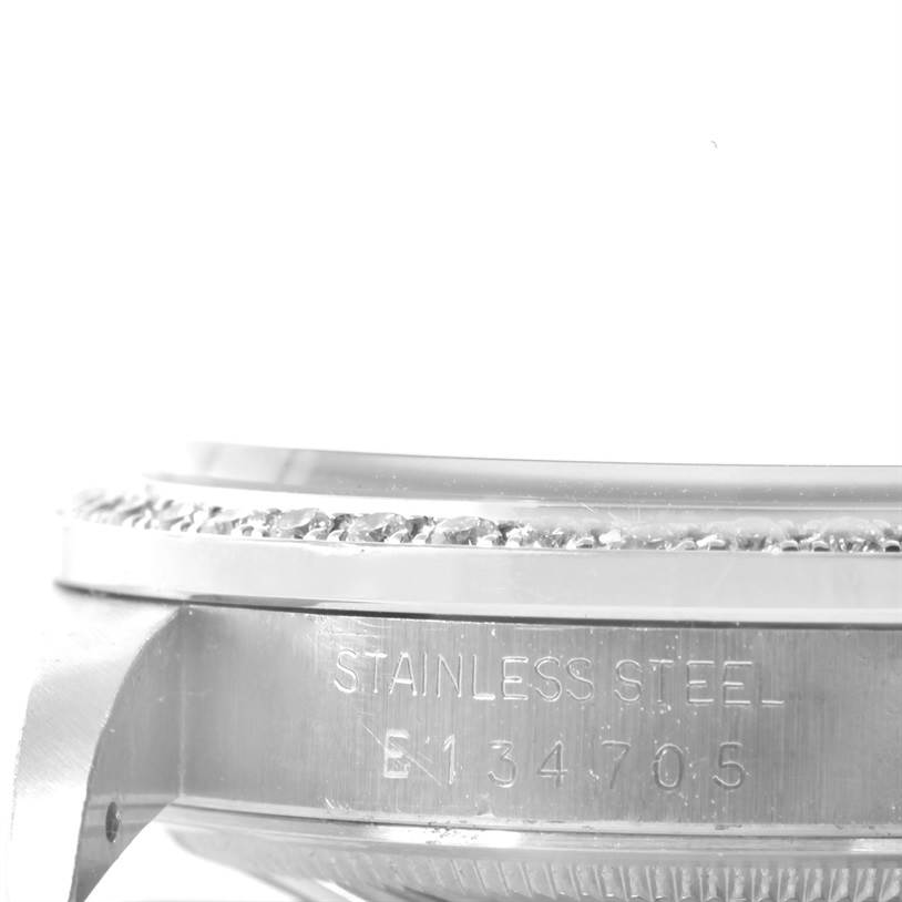 The image shows a close-up side view of the bezel and case of a Rolex Datejust 16234 Men
s Stainless Steel Mother of Pearl Dial 16234 Men
s Stainless Steel Mother of Pearl Dial watch, highlighting the stainless steel material and the serial number.