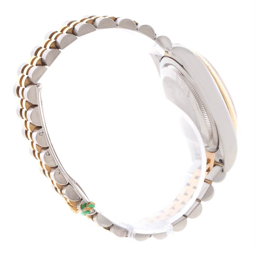 This side view of the Rolex Datejust 116233-CSJ Men
s Stainless Steel Champagne Dial 116233-CSJ Men
s Stainless Steel Champagne Dial watch shows the case back and the jubilee bracelet with its two-tone design.