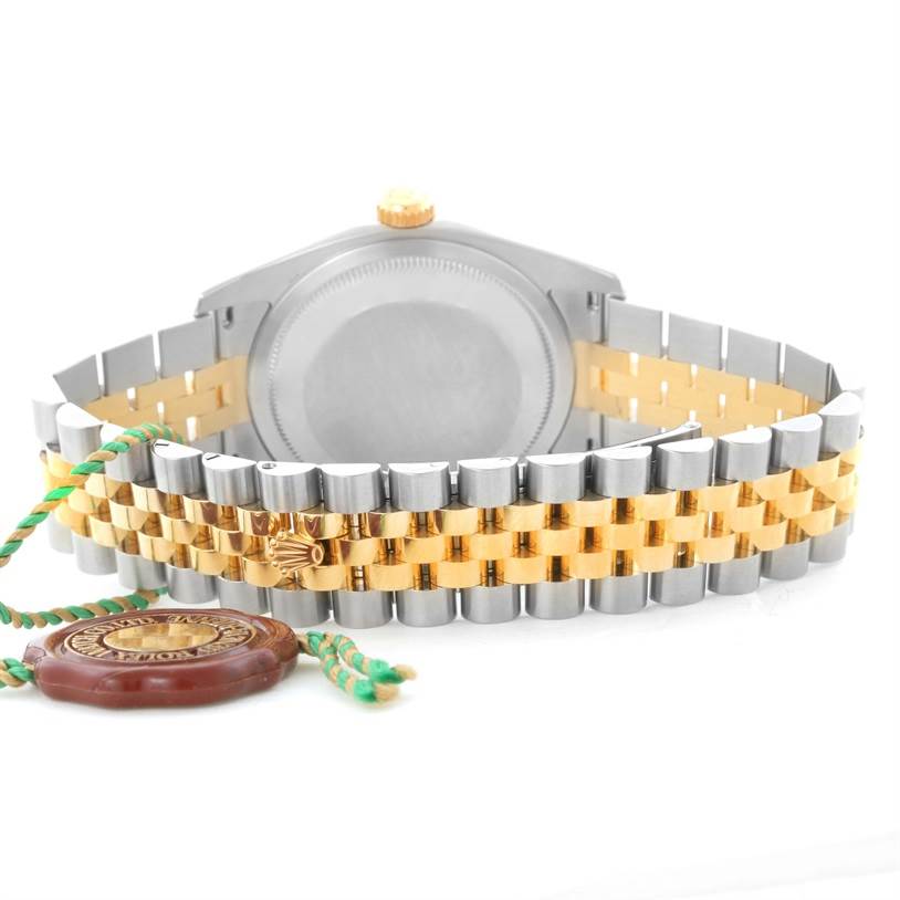 The image shows the back and bracelet of a Rolex Datejust 116233-CSJ Men
s Stainless Steel Champagne Dial 116233-CSJ Men
s Stainless Steel Champagne Dial watch with a two-tone metal design.