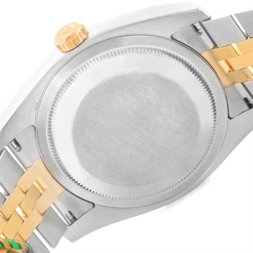 This image shows the back case and part of the bracelet of a Rolex Datejust 116233-CSJ Men
s Stainless Steel Champagne Dial 116233-CSJ Men
s Stainless Steel Champagne Dial watch, viewed from the rear.