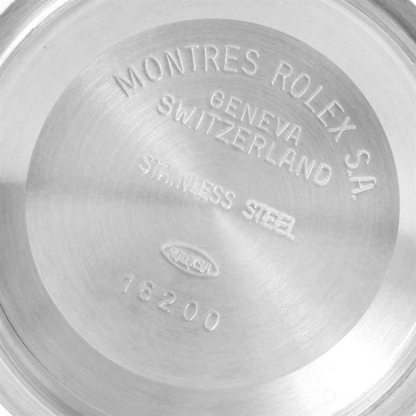 The image shows the stainless steel case back of a Rolex Datejust 16233 Men
s Steel and Gold (two tone) Champagne Dial 16233 Men
s Steel and Gold (two tone) Champagne Dial watch, model number 16200, engraved with branding details.