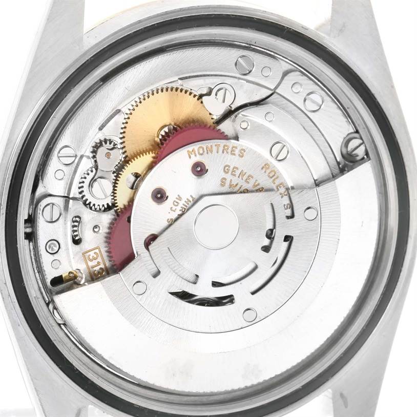 This image shows the inner mechanism and movement of a Rolex Datejust 16233 Men
s Steel and Gold (two tone) Champagne Dial 16233 Men
s Steel and Gold (two tone) Champagne Dial watch from a back angle with the case back removed.