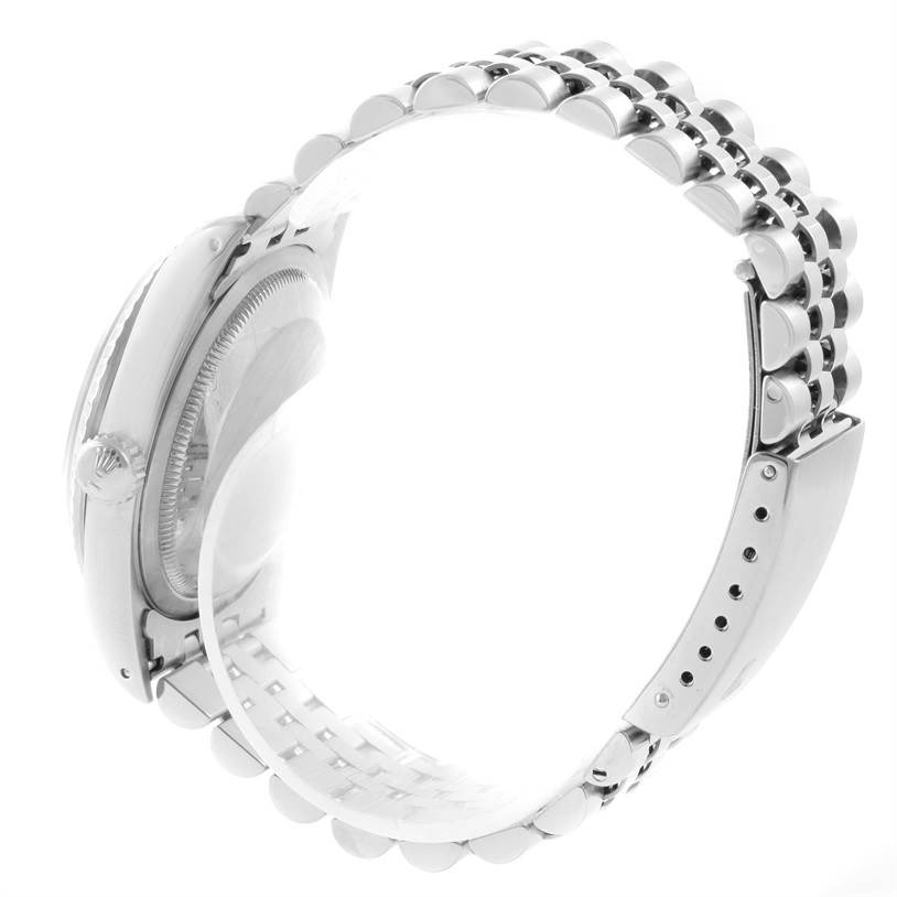 The image shows a side view of a Rolex Datejust 16220 Men's Stainless Steel Beige Dial 16220 Men's Stainless Steel Beige Dial watch, focusing on its bracelet, case, and crown.