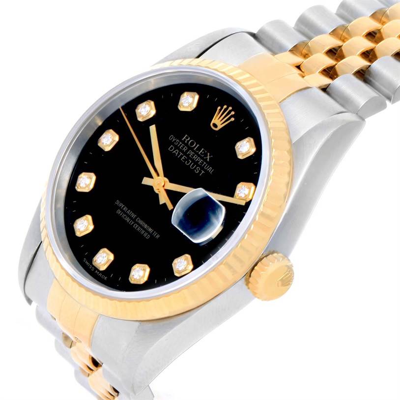 The image shows a close-up angled view of a Rolex Datejust 16233 Men
s Steel and Gold (two tone) Black Dial 16233 Men
s Steel and Gold (two tone) Black Dial watch featuring its black dial, gold bezel, and two-tone bracelet.