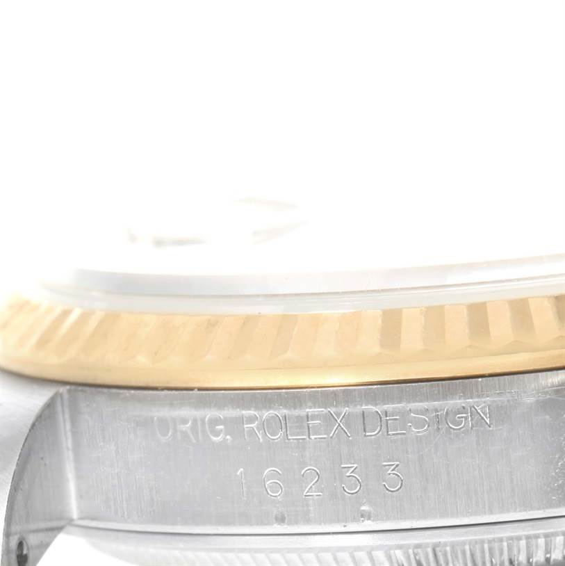 The image shows a close-up angle of the case side, bezel, and the engraved model number "16233" on a Rolex Datejust 16233 Men's Steel and Gold (two tone) White Dial 16233 Men's Steel and Gold (two tone) White Dial watch.
