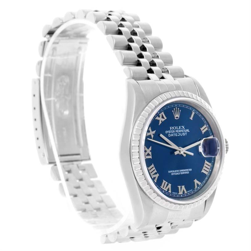 The Rolex Datejust 16220 Men's Stainless Steel Blue Dial 16220 Men's Stainless Steel Blue Dial watch is shown at a slightly angled side view, highlighting the blue dial, Roman numerals, and Jubilee bracelet.