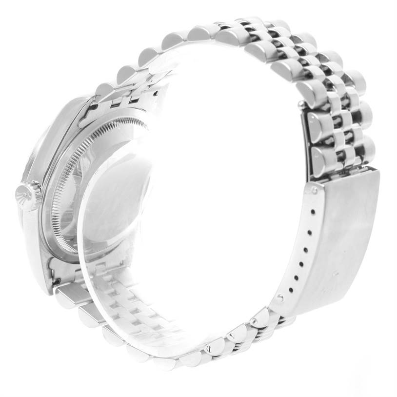 The image shows a Rolex Datejust 16220 Men's Stainless Steel Blue Dial 16220 Men's Stainless Steel Blue Dial watch from a side angle, highlighting the bracelet and partially obscured case back.