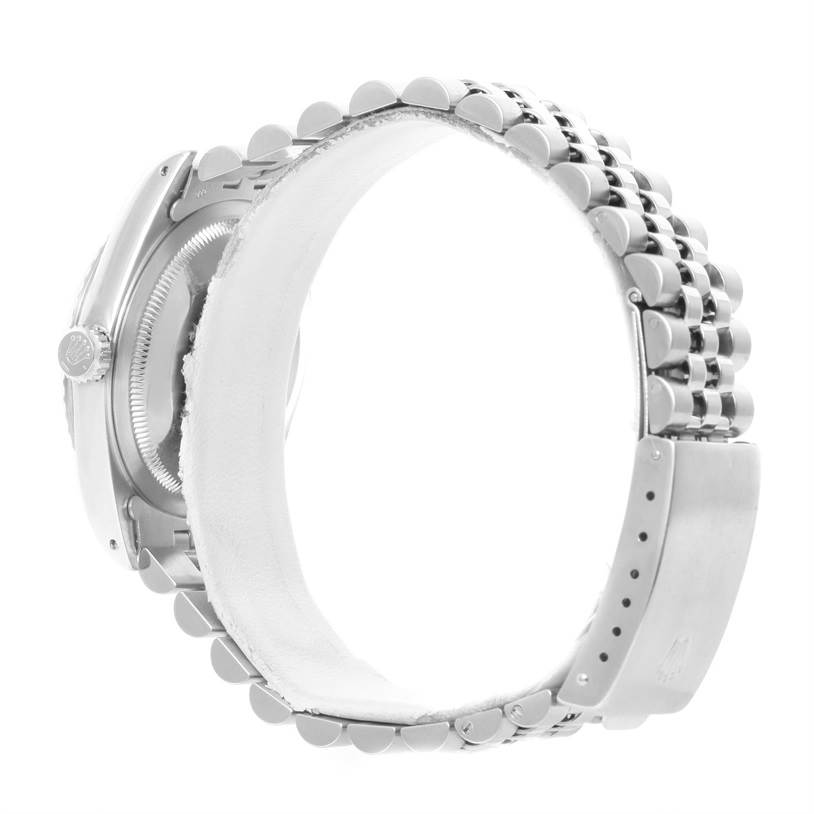 This image shows a Rolex Datejust 16220 Men's Stainless Steel White Dial 16220 Men's Stainless Steel White Dial watch from a side view, highlighting its bracelet and crown.