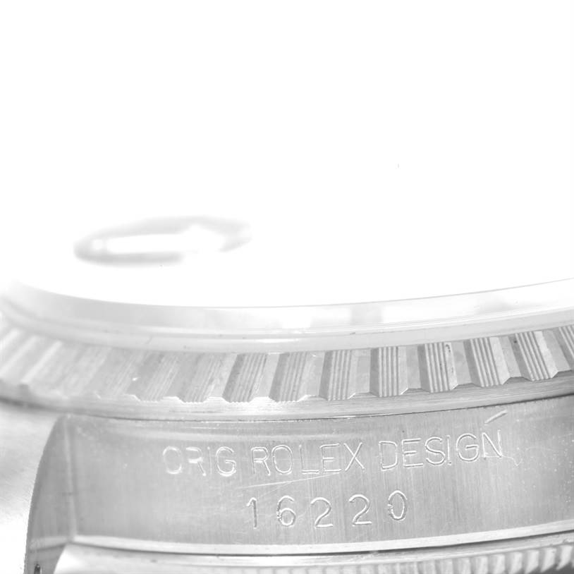 This image shows a close-up of the bezel and case of the Rolex Datejust 16220 Men's Stainless Steel White Dial 16220 Men's Stainless Steel White Dial model, including the "Orig Rolex Design" inscription and model number 16220.