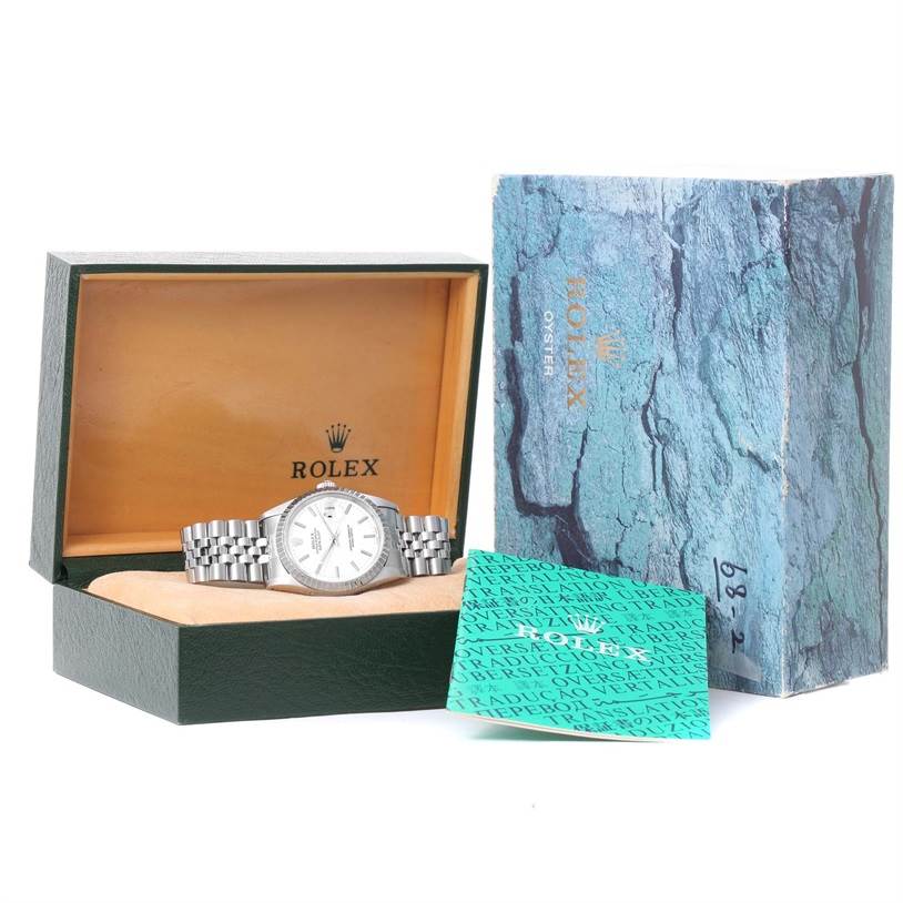 The Rolex Datejust 16220 Men's Stainless Steel White Dial 16220 Men's Stainless Steel White Dial watch is displayed in its open box with a card and its outer packaging beside it.