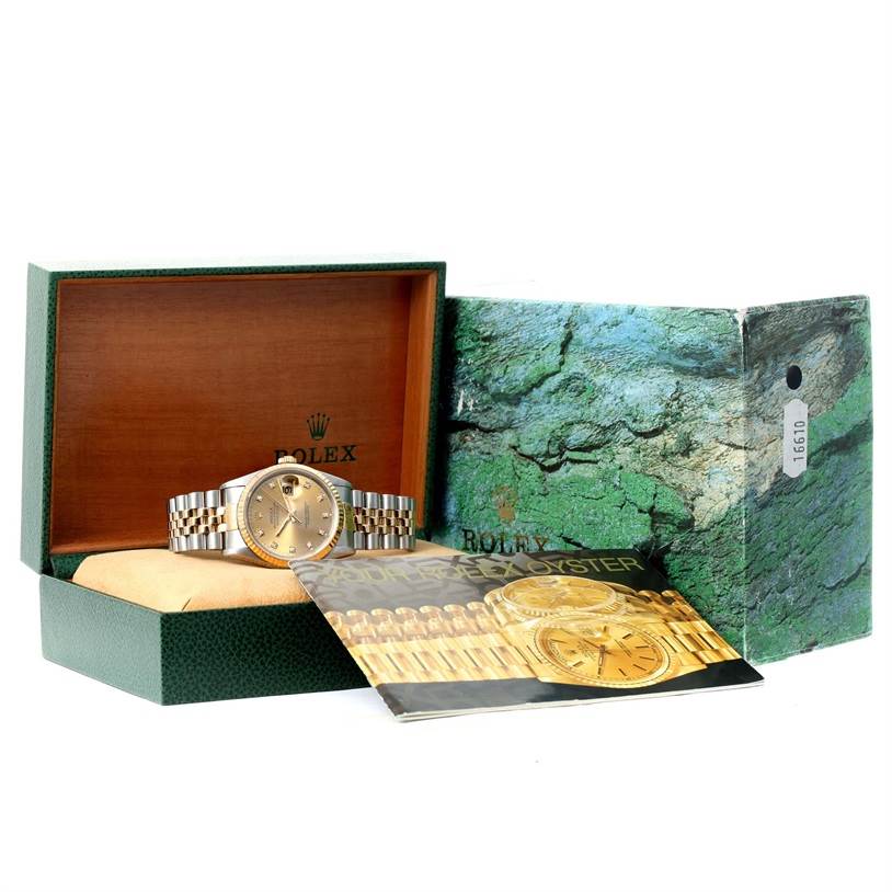 The image shows the Rolex Datejust 16233 Men's Steel and Gold (two tone) Champagne Dial 16233 Men's Steel and Gold (two tone) Champagne Dial watch from the front, inside an open box, with the outer box and booklet visible.
