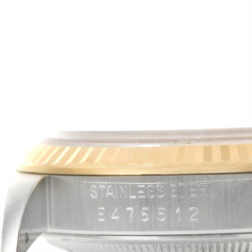 The image shows a close-up side view of the bezel and case with the serial number of a Rolex Datejust 16233 Men's Steel and Gold (two tone) Champagne Dial 16233 Men's Steel and Gold (two tone) Champagne Dial watch.