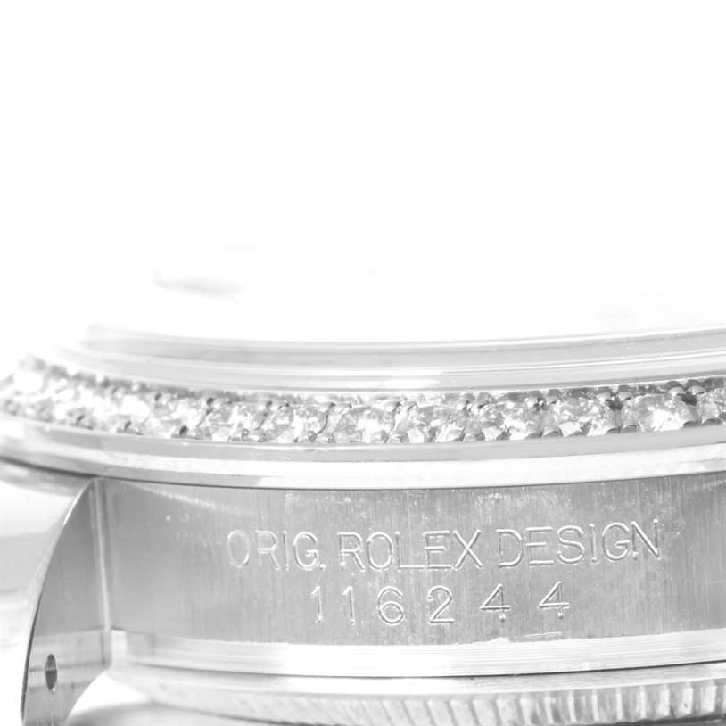This image shows a close-up of the case and diamond bezel of a Rolex Datejust 116244 Men's Stainless Steel Mother of Pearl Dial 116244 Men's Stainless Steel Mother of Pearl Dial watch with the model number engraved.
