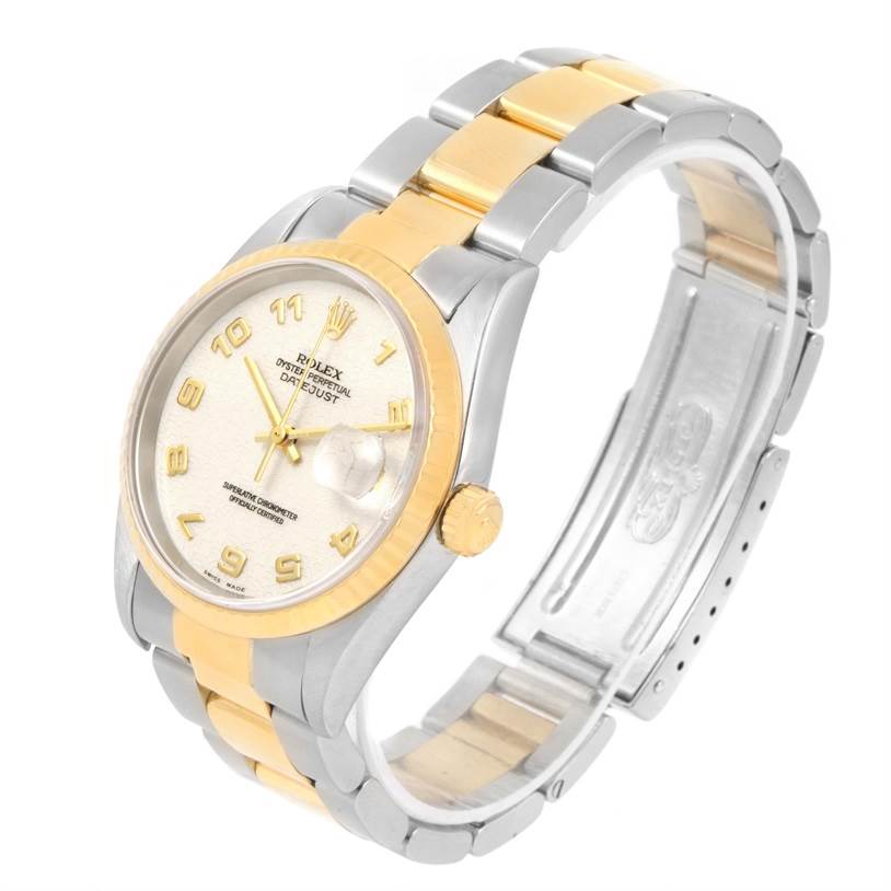 The Rolex Datejust 16233 Men's Steel and Gold (two tone) Beige Dial 16233 Men's Steel and Gold (two tone) Beige Dial watch is shown from a slight side angle, displaying its face, crown, two-tone bracelet, and clasp.