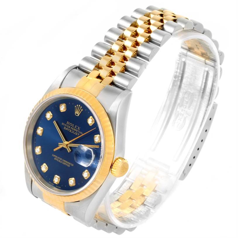 The Rolex Datejust 16233 Men's Steel and Gold (two tone) Blue Dial 16233 Men's Steel and Gold (two tone) Blue Dial watch is shown at an angled top view, displaying its blue dial, gold bezel, and two-tone bracelet.