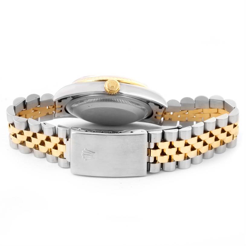 This image shows the side view of a Rolex Datejust 16233 Men's Steel and Gold (two tone) Blue Dial 16233 Men's Steel and Gold (two tone) Blue Dial watch, prominently featuring the crown, case, and two-tone bracelet.