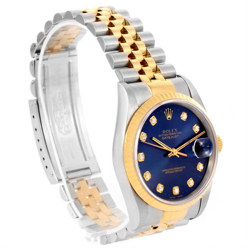 This image shows a Rolex Datejust 16233 Men's Steel and Gold (two tone) Blue Dial 16233 Men's Steel and Gold (two tone) Blue Dial watch angled to highlight the blue dial, diamond markers, and two-tone bracelet.