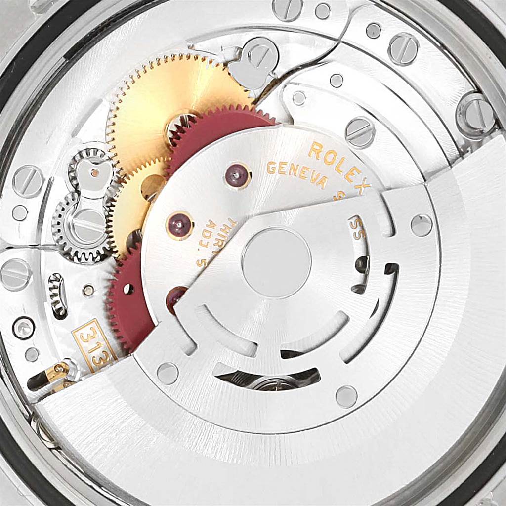 This image shows an internal view of the Rolex Datejust 116200 Men's Stainless Steel Blue Dial 116200 Men's Stainless Steel Blue Dial movement mechanism, highlighting the gears and rotor.