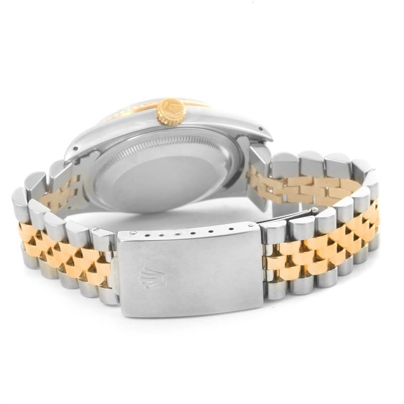 This image shows the back case, crown, and clasp of a Rolex Datejust 16233 Men's Steel and Gold (two tone) Beige Dial 16233 Men's Steel and Gold (two tone) Beige Dial watch, with a two-tone metal bracelet.