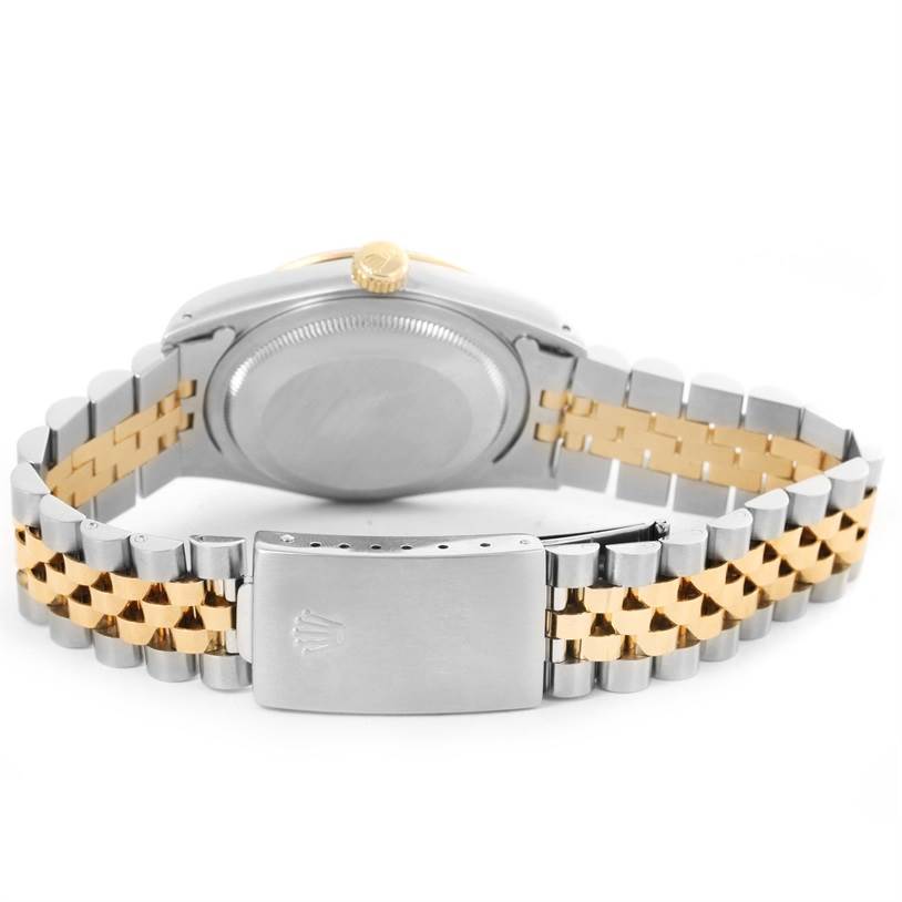 This image shows the back view of a Rolex Datejust 16233 Steel and Gold (two tone) Champagne Dial 16233 Steel and Gold (two tone) Champagne Dial watch, highlighting its two-tone metal bracelet and clasp.