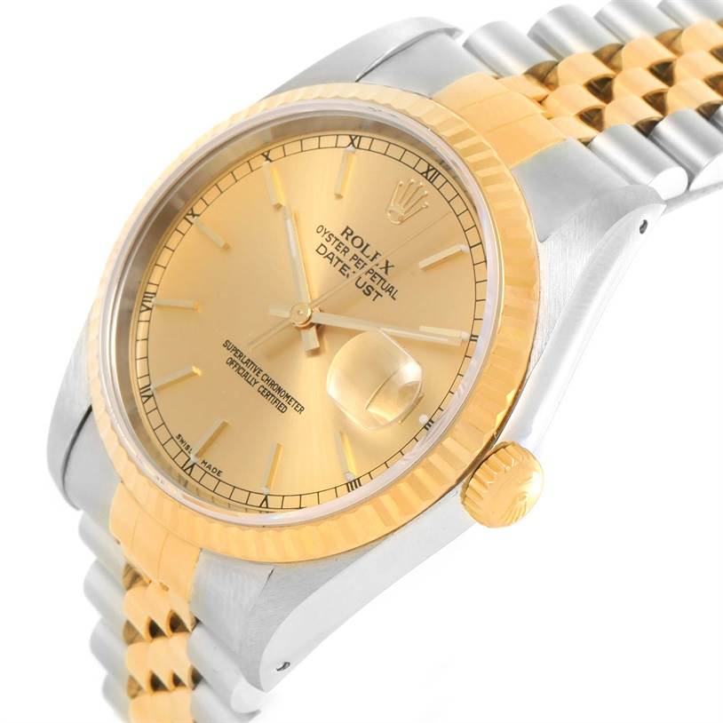 This image shows a close-up angled view of a Rolex Datejust 16233 Steel and Gold (two tone) Champagne Dial 16233 Steel and Gold (two tone) Champagne Dial watch, featuring its dial, crown, and stainless steel and gold bracelet.