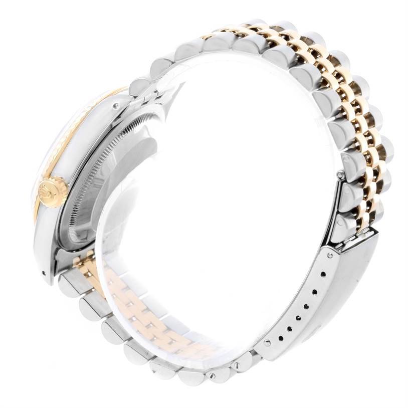 The image shows the side view of a Rolex Datejust 16233 Men's Steel and Gold (two tone) Beige Dial 16233 Men's Steel and Gold (two tone) Beige Dial, highlighting its case, crown, and two-tone bracelet.