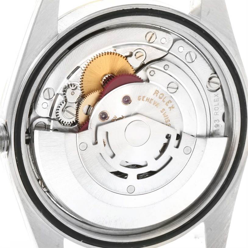 This image shows the inner mechanical movement of a Rolex Datejust 16233 Men's Steel and Gold (two tone) Beige Dial 16233 Men's Steel and Gold (two tone) Beige Dial watch with visible gears and components.